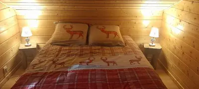 Un ou plusieurs lits dans un hébergement de l'établissement Chalet le Bruleux