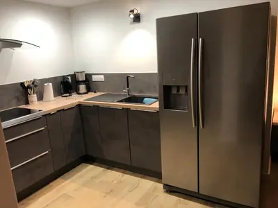 Cuisine ou kitchenette dans l'établissement L'Atelier- Appartement, Sauna, Jardin, Centre Ville, proche commerces et restaurants