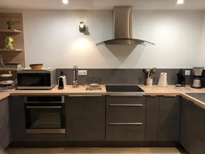 Cuisine ou kitchenette dans l'établissement L'Atelier- Appartement, Sauna, Jardin, Centre Ville, proche commerces et restaurants