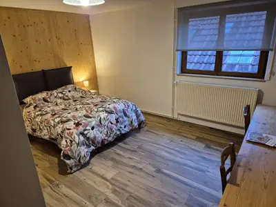 Un ou plusieurs lits dans un hébergement de l'établissement Chambres Thirion