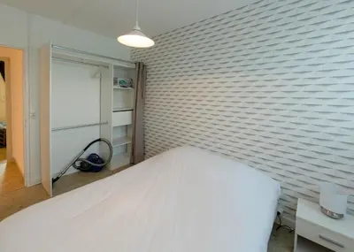 Un ou plusieurs lits dans un hébergement de l'établissement Appart'Hôtel - l'île en mouvement