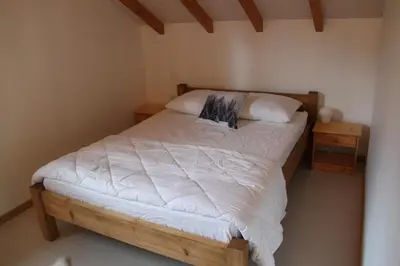 Un ou plusieurs lits dans un hébergement de l'établissement Chalet de la Rigue