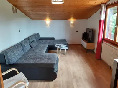 Coin salon dans l'établissement Chalet Les Chardons