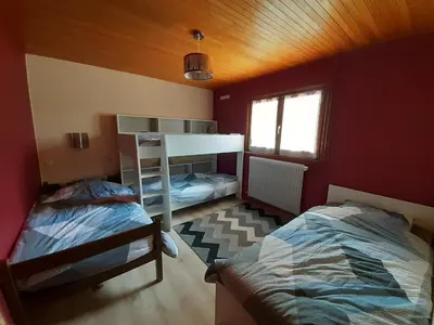 Un ou plusieurs lits dans un hébergement de l'établissement Chalet Les Chardons