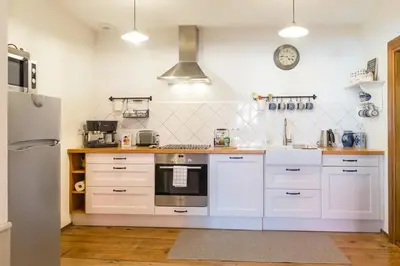 Cuisine ou kitchenette dans l'établissement Maison cosy à Kientzheim + Parking