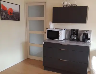 Cuisine ou kitchenette dans l'établissement gîte Les Coquelicots