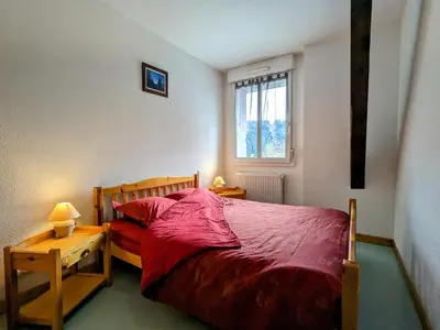 Un ou plusieurs lits dans un hébergement de l'établissement Gîte à Gérardmer - Proche lac et pistes, Chem cheminée, 2 chambres - FR-1-589-108