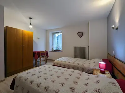 Un ou plusieurs lits dans un hébergement de l'établissement Charmant Gîte avec Garage et Local Vélos au Pied des Pistes de La Bresse - FR-1-589-127