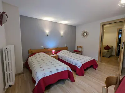 Un ou plusieurs lits dans un hébergement de l'établissement Charmant Gîte avec Garage et Local Vélos au Pied des Pistes de La Bresse - FR-1-589-127