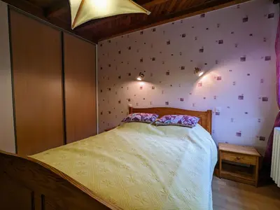 Un ou plusieurs lits dans un hébergement de l'établissement Maison de Montagne à La Bresse, 2 Chambres, Confort et Activités, Garage, Wifi Inclus - FR-1-589-152