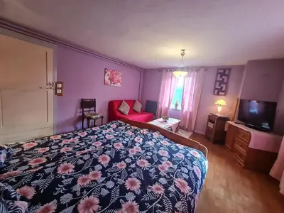 Un ou plusieurs lits dans un hébergement de l'établissement Gîte chaleureux avec terrasse privée à Gérardmer - FR-1-589-159