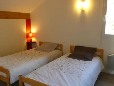 Un ou plusieurs lits dans un hébergement de l'établissement Gîte calme avec terrasse près de Gérardmer - FR-1-589-158