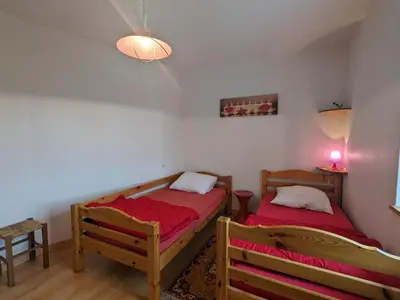 Un ou plusieurs lits dans un hébergement de l'établissement Gîte Alsace proche forêts, randonnée, stations de ski, 2 salons, terrasse sud, cheminée, animaux acceptés - FR-1-589-200
