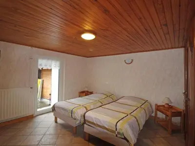 Un ou plusieurs lits dans un hébergement de l'établissement Gîte paisible avec terrasse et WIFI, proche de Gérardmer - 2 chambres, animaux acceptés - FR-1-589-216