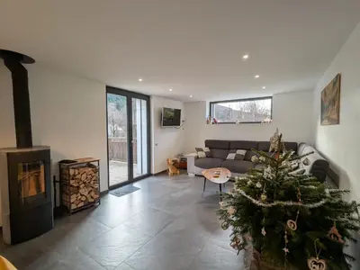 Coin salon dans l'établissement Gîte 4 étoiles avec sauna et terrasses pour 14 pers. - FR-1-589-319