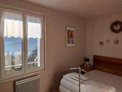 Un ou plusieurs lits dans un hébergement de l'établissement Maison indépendante avec jardin, terrasse et cheminée à Saulxures-sur-Moselotte - FR-1-589-339