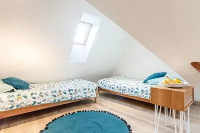 Un ou plusieurs lits dans un hébergement de l'établissement Gîte La Rodernelle - Sauna - Patio - Climatisation - Vue sur Château du Haut Kœnigsbourg