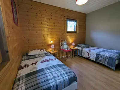 Un ou plusieurs lits dans un hébergement de l'établissement Chalet rénové proche du Valtin – Idéal pour famille, randonnées et ski, Wifi, luges fournies - FR-1-589-150