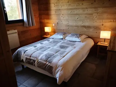 Un ou plusieurs lits dans un hébergement de l'établissement Chalet à L'Orée du Bois