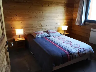 Un ou plusieurs lits dans un hébergement de l'établissement Chalet à L'Orée du Bois