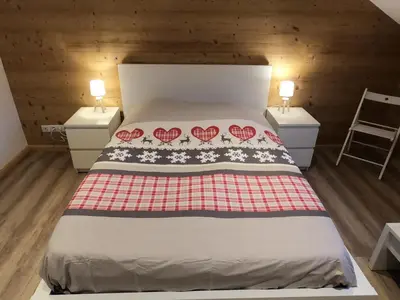 Un ou plusieurs lits dans un hébergement de l'établissement Chez Léa et Lolo - L'Alpina