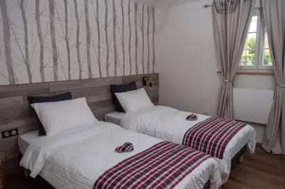 Un ou plusieurs lits dans un hébergement de l'établissement Gîte Cosy L'Ecrin du Ried PROCHE EUROPA-PARK