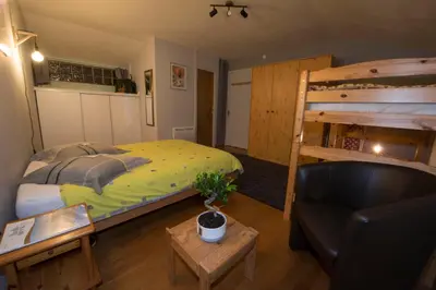 Un ou plusieurs lits dans un hébergement de l'établissement Le Cocon du Village Gérardmer