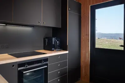 Cuisine ou kitchenette dans l'établissement Chalet Panorama - luxe en altitude dans les Vosges