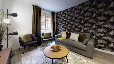 Coin salon dans l'établissement Appartement 2 chambres La Commanderie