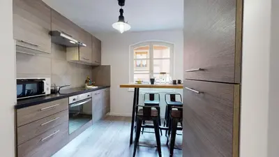 Cuisine ou kitchenette dans l'établissement Appartement 2 chambres La Commanderie