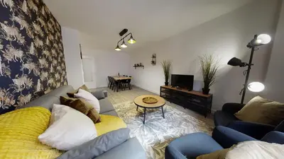 Coin salon dans l'établissement Appartement 2 chambres La Commanderie