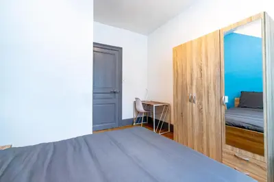 Un ou plusieurs lits dans un hébergement de l'établissement Appart'Hôtel - Le Cocon de l'Est