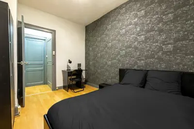 Un ou plusieurs lits dans un hébergement de l'établissement Appart'Hôtel - Le Cocon de l'Est