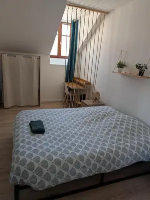Un ou plusieurs lits dans un hébergement de l'établissement Appart'Hôtel Le Strasbourg - RENOVÉ, CALME ET NETFLIX