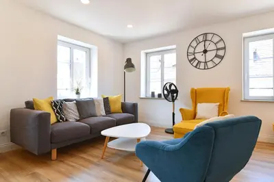 Coin salon dans l'établissement Appartement L'Oriel avec Parking