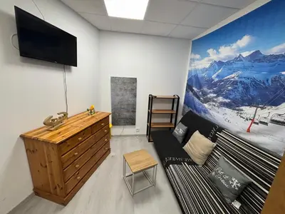 Télévision ou salle de divertissement dans l'établissement Résidence Belle Hutte 2
