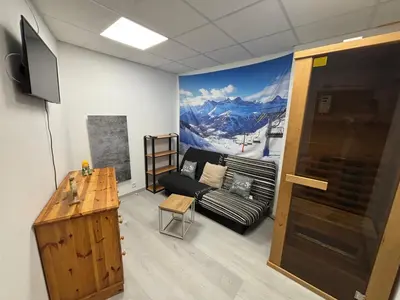Télévision ou salle de divertissement dans l'établissement Résidence Belle Hutte 2