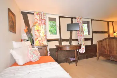 Un ou plusieurs lits dans un hébergement de l'établissement CHEZ CECILE Bed and Breakfast chez le VIGNERON