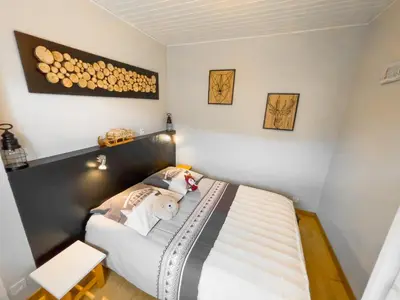 Un ou plusieurs lits dans un hébergement de l'établissement Joli appartement T2, Escale Les Airelles, rez de jardin proche lac