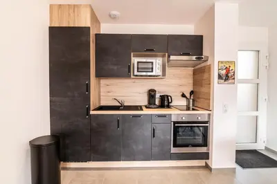 Cuisine ou kitchenette dans l'établissement Les Balcons De La Haie Griselle gîte 4/pers