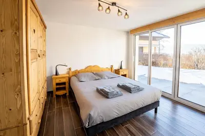 Un ou plusieurs lits dans un hébergement de l'établissement Moho Mountain Home