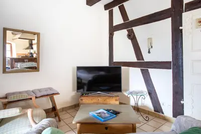 Télévision ou salle de divertissement dans l'établissement Gite 
