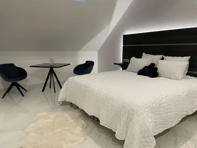 Un ou plusieurs lits dans un hébergement de l'établissement Les chambres d'à côté