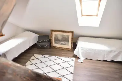 Un ou plusieurs lits dans un hébergement de l'établissement L'APPARTEMENT