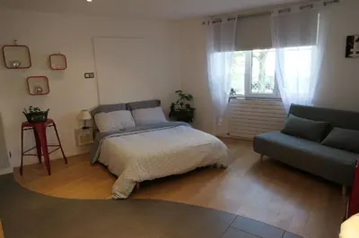 Un ou plusieurs lits dans un hébergement de l'établissement Au Petit Paradis