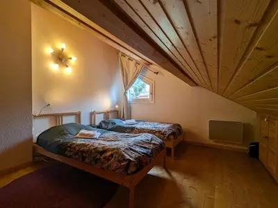Un ou plusieurs lits dans un hébergement de l'établissement Chalet chaleureux à Gérardmer, vue pistes, 4 pers. - FR-1-589-371