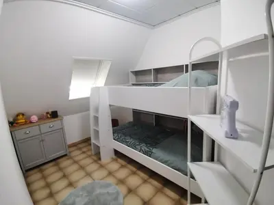 Un ou plusieurs lits dans un hébergement de l'établissement Villa kerangoues gîte 3 étoiles