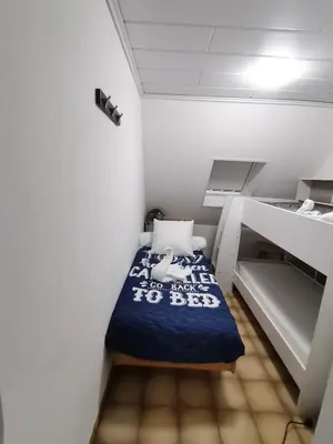 Un ou plusieurs lits dans un hébergement de l'établissement Villa kerangoues gîte 3 étoiles