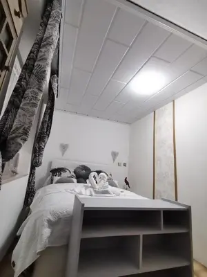 Un ou plusieurs lits dans un hébergement de l'établissement Villa kerangoues gîte 3 étoiles