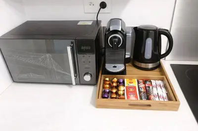 Cuisine ou kitchenette dans l'établissement COSY LIVING